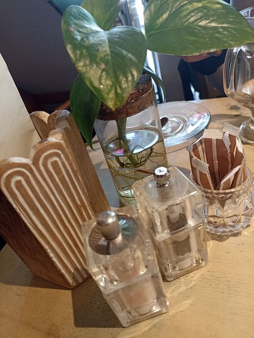 A plant and condiment dispensers at The Vibe in Liverpool