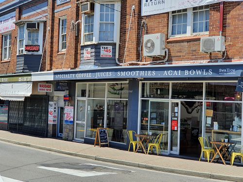 Front and outdoor seating at Swallow Coffee Traders in Rockdale