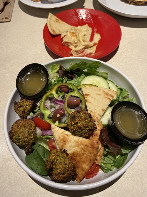 Traditional Greek salad with falafel and hummus  at Zoës Kitchen - St John's in Jacksonville