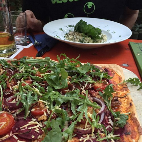 Flammkuchen in the foreground and risotto in the background  at Viasko - Bar und Restaurant in Berlin