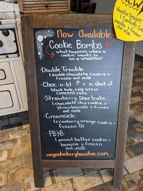 Cookie bomb drinks menu board. The Choc-o-lit is divine. at Sinfull Bakery in Houston