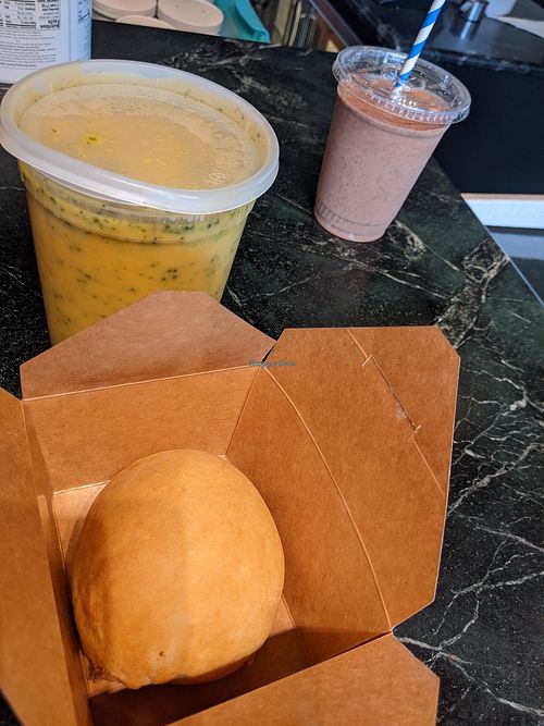 My takeout brunch, hot gr the pot broccoli cheese soup, breakfast egg & sausage kolache with choc-o-lit cookie bomb smoothie. at Sinfull Bakery in Houston