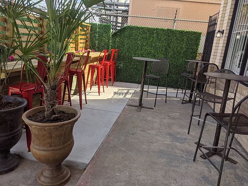 Outdoor patio dining area at Sinfull Bakery in Houston