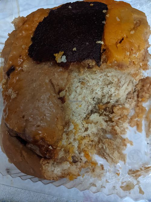 "The Elvis" cinnamon roll - banana peanut butter filling, with peanut butter glaze topped with a strip of bakun. Delicious! at Sinfull Bakery in Houston