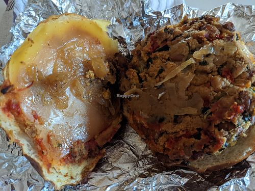 Chef Dylan's delicious smokey bean burger on a pretzel bun, with provolone cheese after being reheated at home. at Sinfull Bakery in Houston