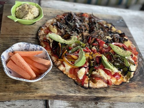 Half half pizza, mushrooms and I forgot the other one  at Layla Restaurant Plants & Mushrooms in Puerto Morelos