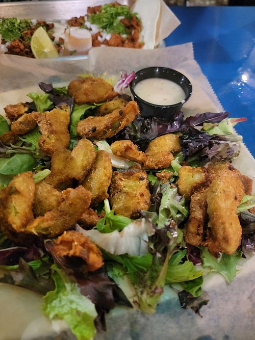 Fried avo slices with cilantro vinaigrette (instead of dairy/egg chipotle crema) at Taco + Tequila  in Savannah