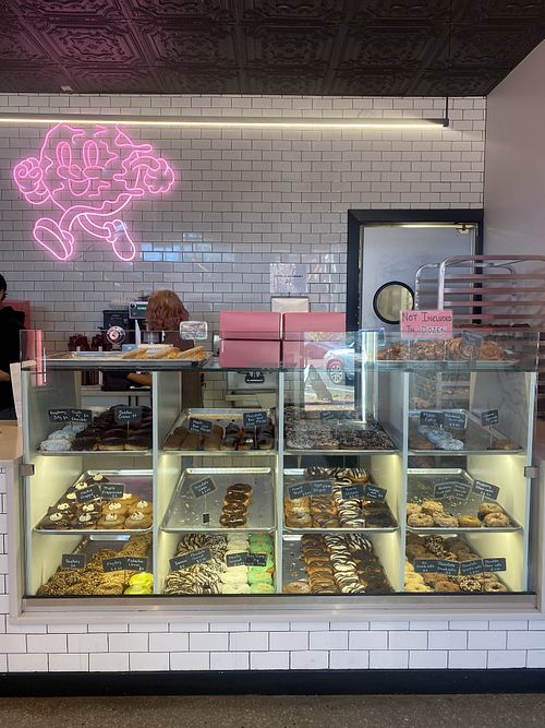 Ordering Station and Display - Cool Personnel in Backgroundd  at Donut Run in Washington