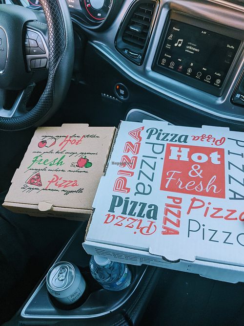 The kids pizza next to the regular size pizza. at Fatty Vegan in Ventura