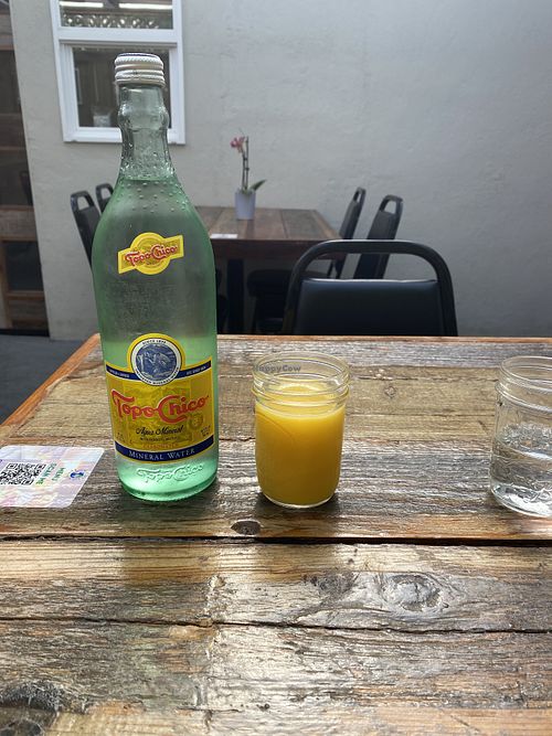 Huge bottle of sparkling water, fresh OJ, and water 💦   at Sky Cafe in South San Francisco