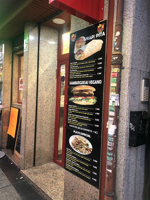 View of the entrance and menu at Sana Vegetariana in Madrid