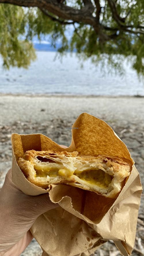 Enjoying the vegan curry pie at the lakefront   at The Doughbin Bakery in Wanaka