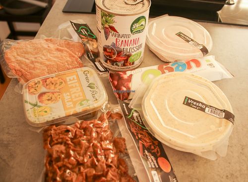 products from the store: schnitzel, not-duck, mayo-salads, Vego chocolate bar and canned banana blossoms at Vegana in Bratislava