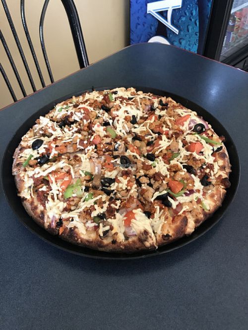 Vegan Supreme Pizza
Daiya Cheese, Soy Pepperoni, Soy Sausage, Soy Chicken, Mushrooms, Red Onions, Green Bell Peppers, Black Olives & Roma Tomato. at Vegan Korner in Grand Terrace