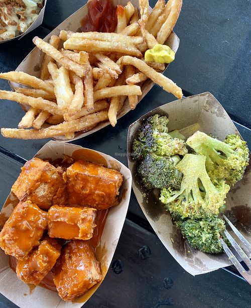 Vegan Buffalo tofu wings, broccoli with nutritional yeast, and fries at Porch in Rochester