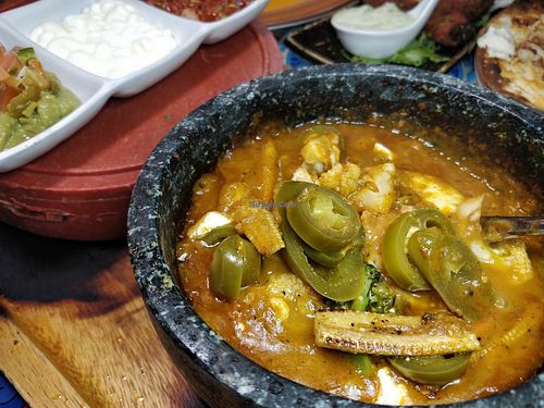 Molcajete Queso (can be veganised)- grilled vegetables served with Mozerella cheese, sauteed onions and bell peppers, topped with house special tomatillo habanero sauce, accompanied with warm flour/corn tortillas, guacamole, crema and house salsa at La Salsa Kitchen & Bar in Central Singapore