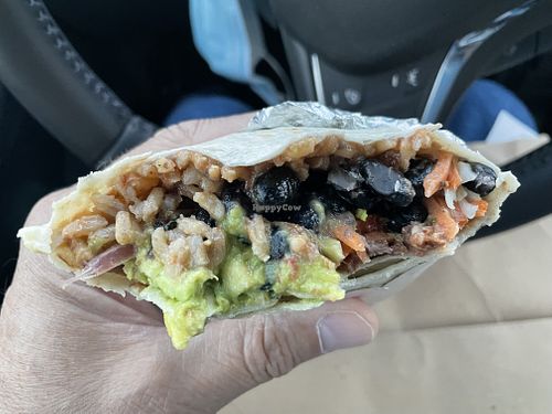 Burrito with a few bites gone at Más Veggies Taqueria in Corte Madera