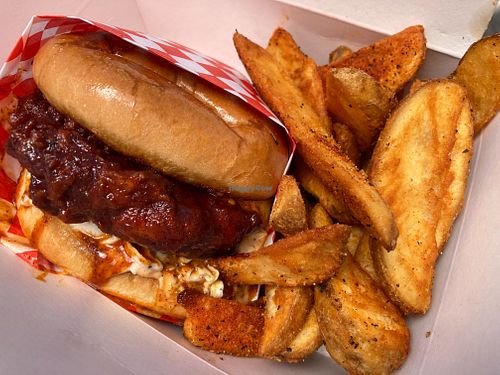 Nashville hot chick’n sandwich combo with Cajun wedges at Don't be Chick'n in San Jose