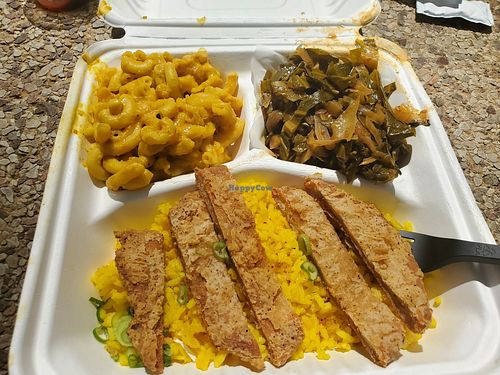 Chicken platter with rice, collards, and mac + cheese at Pure Soul in Durham