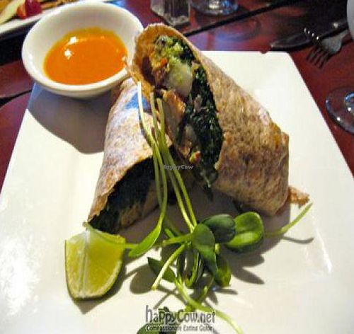 Breakfast Burrito with potatoes, sautéed kale, guacamole, smoked tofu, chile de árbol. at Caravan of Dreams in New York City