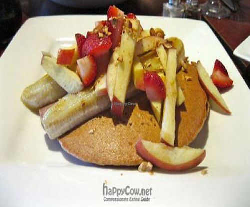 Berry Pancakes with Two spelt pancakes, grilled banana, fresh fruit, chopped nuts. at Caravan of Dreams in New York City