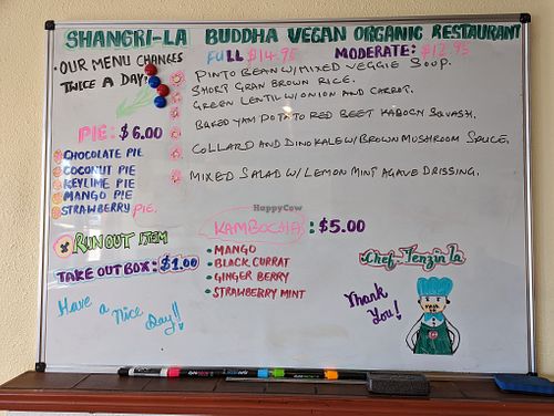Menus are outside and inside on this whiteboard, changed twice a day at Shangri-la Buddha in Albany