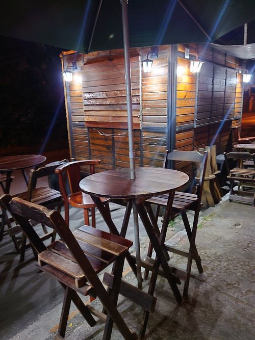 Outside - some tables to sit, chill and eat at Namasveg Plant Food in Ubatuba