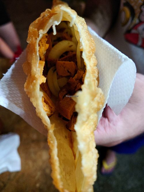 Pastel with smoked sausage and onion filling at Namasveg Plant Food in Ubatuba