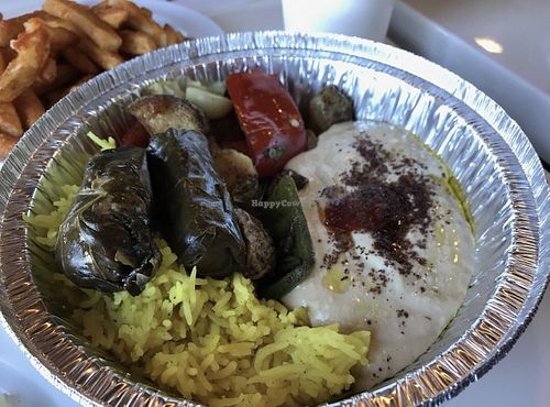 Hummus, rice, dolmas, baba ganoush, and mixed veggies   at Gyro Paradise Mediterranean Grill in St Joseph