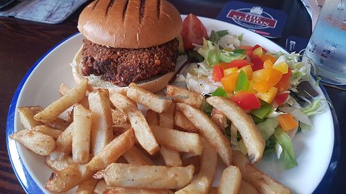 Bangkok bad boy burger with chips and salad at The Top House in Filey