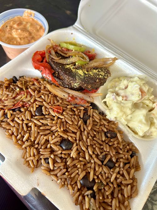 Soy burger, potato salad, rice and beans with a side of cashew cream sauce.  at Natural Plaza in Jarabacoa