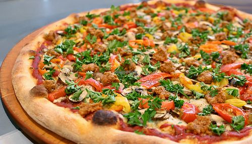 The Mt. Diablo vegan pizza with Miyoko's plant-based mozzarella, Beyond Meat spicy Italian sausage, peppers and a sprinkling of parsley.  at Pizza My Heart - Evergreen in San Jose