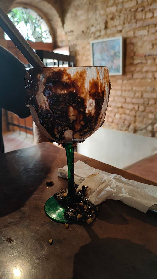 The glass is only covered with hazelnut cream on the outside. Not sure if we were supposed to lick it off, but this seemed like a sad waste of food. at Bandolim in Rio De Janeiro