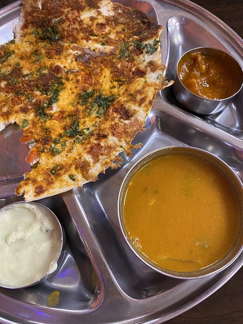 Half of our Jalapeno Tomato Gunpowder Uthappam. Very spicy but so good!  at Dosa Hut in Rocky Hill