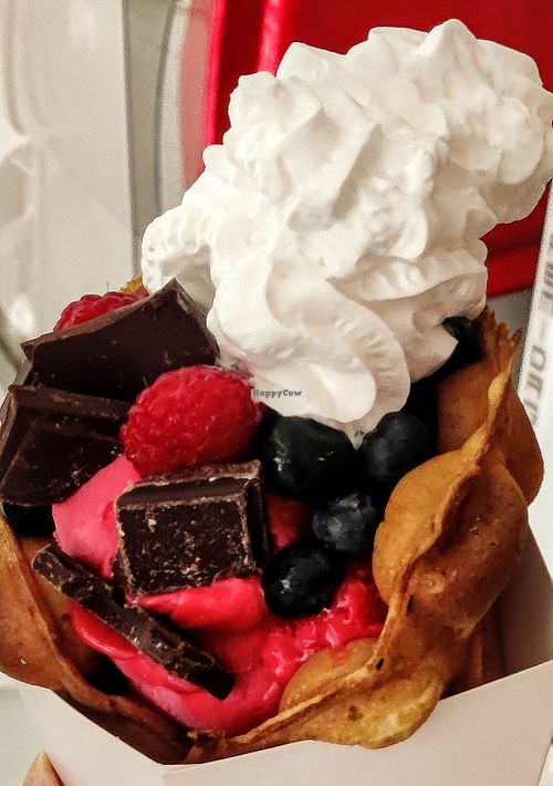 Bubble waffle raspberry ice cream blueberries raspberries peanutbutter choc butter cream (vegan) at Blub - Marienstr in Stuttgart
