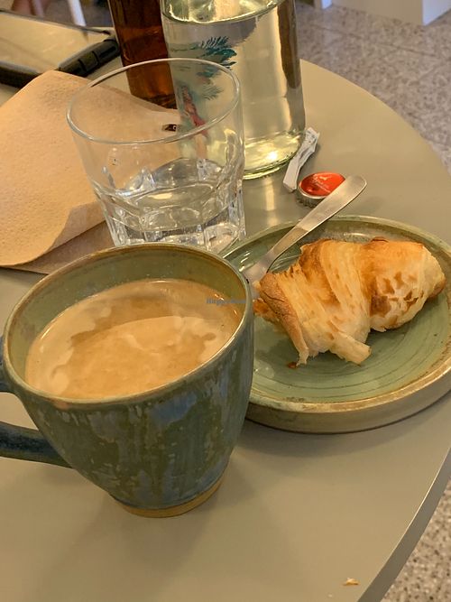 Cappuccino with croissant 🥐  at Bioma in Buenos Aires