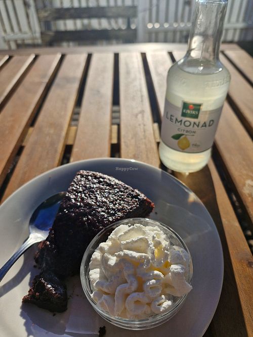 Fluffy mudcake with whipped cream and lemonade at Beijers Parks Cafe in Malmo