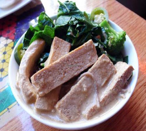 weekday special bowl: sliced western tofu, soba noodles, tahini, greens and broccoli at Sacred Chow in New York City