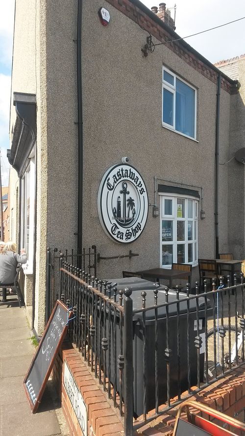 Exterior and outside seating at Castaways Tea Shop in Seaton Sluice