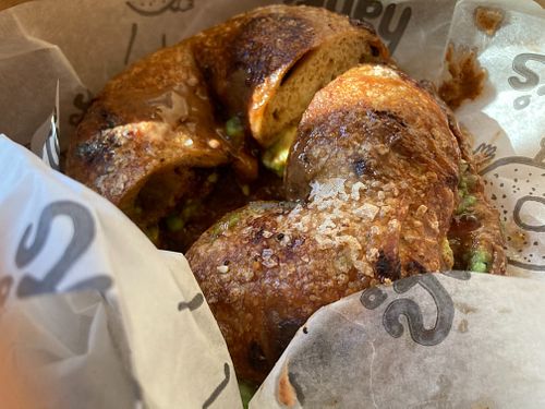 Sea salt chocolate chip bagel with almond butter, house butter and avocado  at Hank's Bagels in Burbank