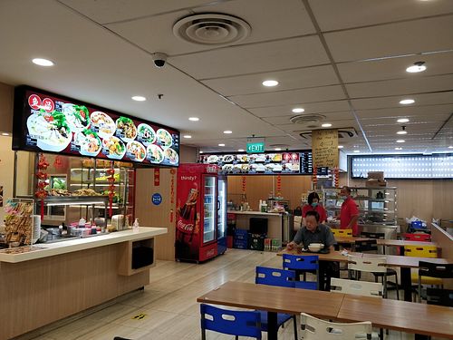 Food court dining area at Vegetarian 素 - Peninsula Plaza in Central Singapore