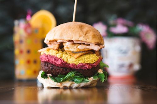 Legendary burger - King Bobby. Beetroot falafel patty, local greens, two types of homemade hummuses, nachos and homemade vegan garlic mayo. at Foam and Fork in Gzira