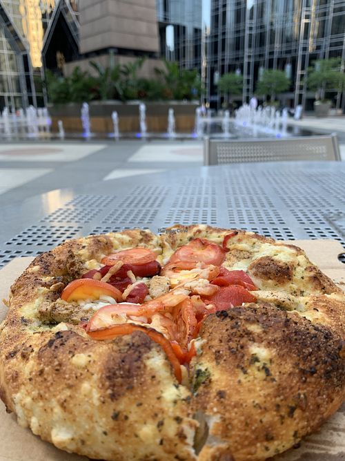 Pesto, fresh toms, vegan chik’n Plaza at PPG Place fountains at Ephesus Pizza in Pittsburgh
