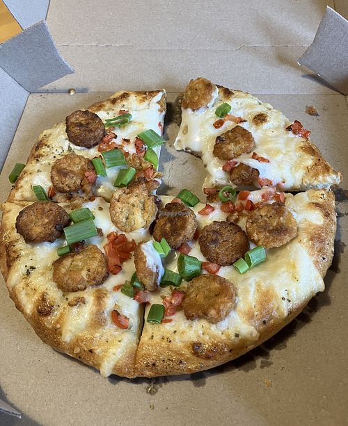 Vegan White Potato pizza (small). Comes topped with crispy tater tots. Loved it. at Toppers Pizza in Lakeville