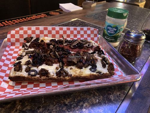 Vegan pizza w sausage and olives   at Guerrilla Pizza  in Las Vegas
