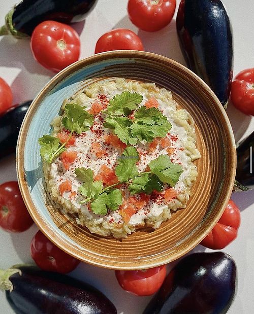 Baked eggplants with tomatoes and tahini. Photo by Israel Grill at Israel Grill in Krasnodar