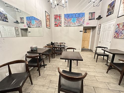 About a dozen seats for dining in   at Bellucci Pizza in Astoria