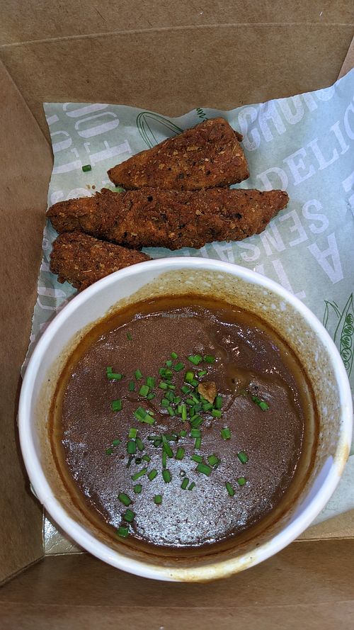 Zinger strips with gravy dipper, note the dried ring round the edge of the gravey at Planet Vegan Diner in Liverpool