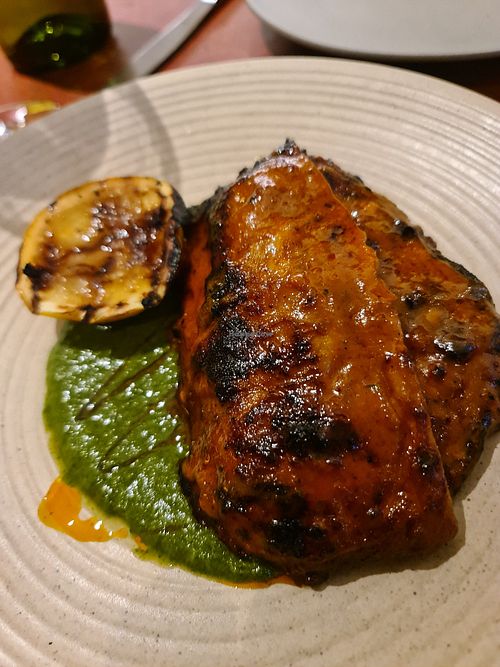 FIRE ROASTED CHICKEN, BASTED IN A FERMENTED PERI PERI
SAUCE.SERVED WITH CHIMICHURRI
 at Lona Misa in South Yarra