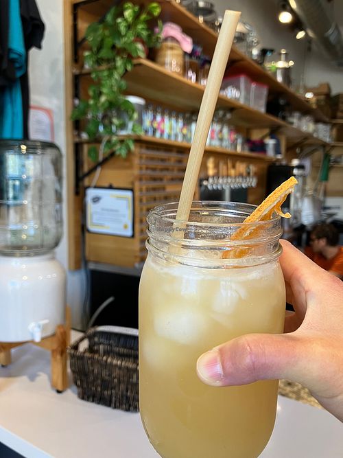 Endless summer mocktail: orange mango kombucha mixed with a pineapple jalapeño shrub at KC Kombucha in Sacramento